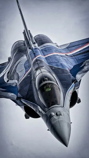 Majestic Dark Blue Fighter Jet In Flight Wallpaper