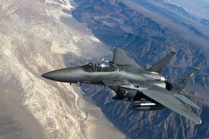 Majestic F-15c Eagle Jet Fighter In Flight Wallpaper