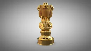 Majestic Golden Ashoka Pillar Under A Gray Sky Wallpaper