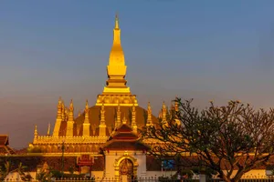 Majestic Golden Pha That Luang In Vientiane Wallpaper