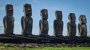 Majestic Moai Statues Cast Shadows At Sunset Wallpaper