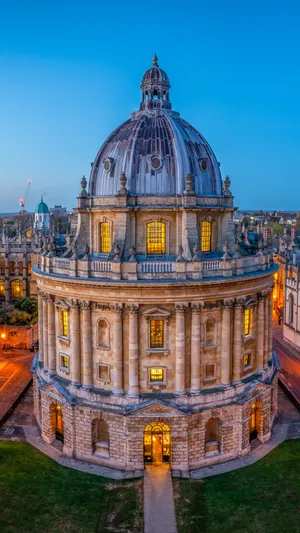 Majestic View Of Radcliffe Camera In Oxford University At Nighttime Wallpaper