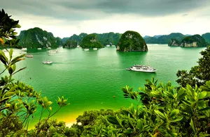 Majestic View Of The Emerald Green Lagoon In Halong Bay Wallpaper