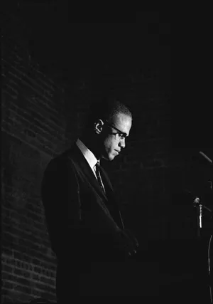 Malcolm X Speakingat Podium Wallpaper