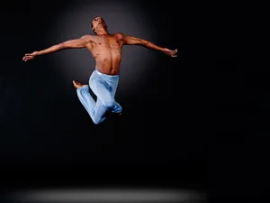 Male Dancer Mid-air Dance Pose Wallpaper