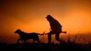 Man And His Best Friend Hunting Together Wallpaper
