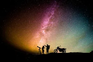 Man And Woman With Telescope Wallpaper