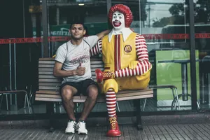 Man Beside Mcdonald's Mascot Wallpaper