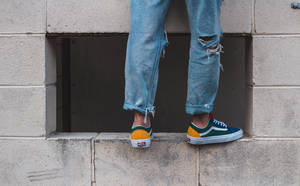 Man In Pair Of Green-and-white Low-top Vans Wallpaper