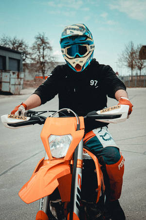 Man Mounted On Ktm Bike Wallpaper