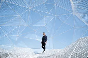 Man Standing Wearing Blue Long-sleeved Shirt Wallpaper