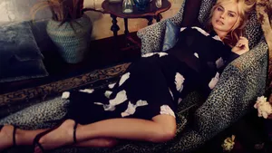 Margot Robbie On Leopard Texture Sofa Wallpaper