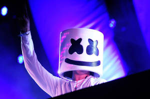 Marshmello Performing On A Neon-lit Blue Stage Wallpaper
