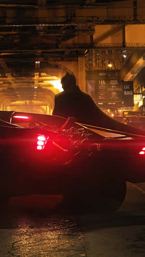 Marvel At The Sprawling Batman City Skyline At Night Wallpaper