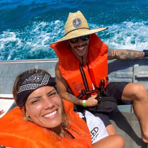 Matheus Nicolau With Wife On Boat Wallpaper