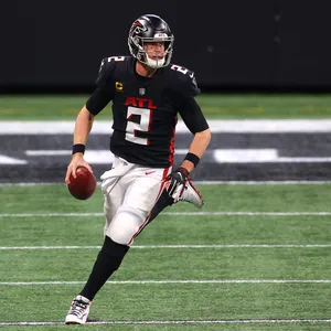 Matt Ryan Running And Holding A Ball Wallpaper