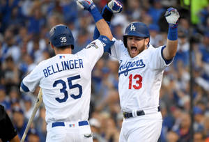 Max Muncy Cheering With Teammate Wallpaper