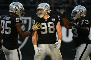 Maxx Crosby Celebrating With Raiders Teammates. Wallpaper