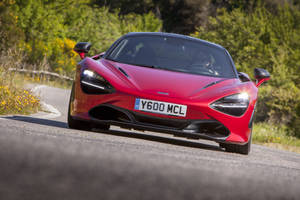 Mclaren 720s 4k On A Road Wallpaper