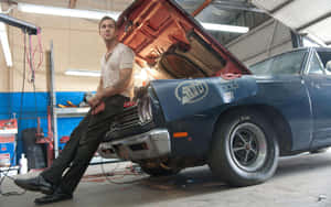 Mechanic Leaningon Classic Carin Garage.jpg Wallpaper