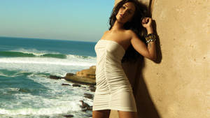 Megan Fox At The Beach In An Eye-catching White Dress Wallpaper
