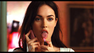 Megan Fox Sticks Out Her Tongue In A Sultry Pose. Wallpaper