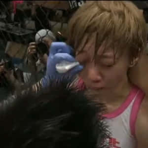 Megumi Fujii In Combat With Jessica Aguilar In 2012 Wallpaper