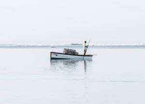 Men In Boat On Mauritius Wallpaper