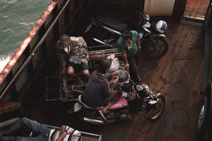 Men On Boat In Cambodia Wallpaper