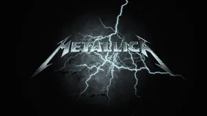 Metallic Logo In Bright Lightning Wallpaper