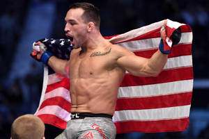 Michael Chandler Holding Flag Behind Back Wallpaper