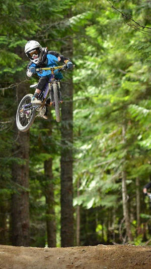 Mid Air Slopestyle 4k Mountain Bike Trick Wallpaper