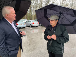 Mike Gibbons Talking To Local While Raining Wallpaper