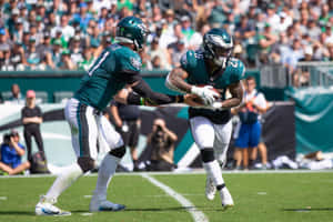 Miles Sanders Across The Court Wallpaper