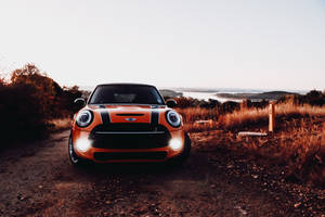 Mini Cooper In Orange Shade Wallpaper