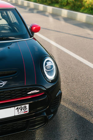 Mini Cooper Logo Of A Black And Red Mini Cooper Vehicle Wallpaper