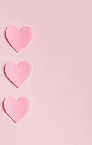 Minimalist Baby Pink Hearts Wallpaper