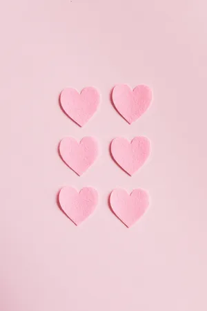 Minimalist Hearts On Pastel Pink Colors Wallpaper