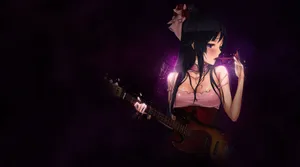 Mio Akiyama Strumming Her Bass In A Dramatic Light Wallpaper
