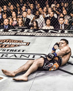 Mixed Martial Artist Nick Diaz On The Floor Wallpaper