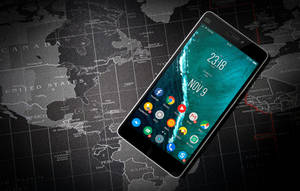 Mobile Phone On A Travel Map Wallpaper