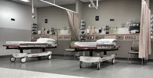 Modern Hospital Bed In Emergency Room Wallpaper
