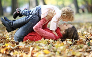 Mom And Son On Her Knees Wallpaper
