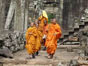 Monks Strolling In The Historical Site Of Angkor Thom Wallpaper