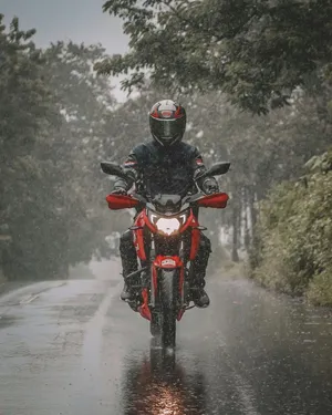 Motorcyclistin Rain Wallpaper