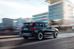 Moving Black Bmw Ix3 M Sport Wallpaper