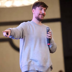 Mr Beast Pointing With Microphone Wallpaper