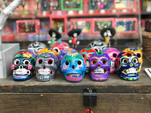 Multi-colored Sugar Skull Figurines Wallpaper