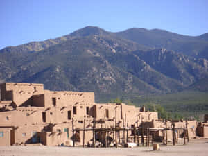 Multilevel Adobe Dwellings In Taos Pueblo Wallpaper