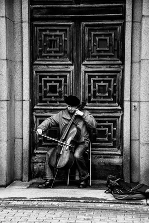 Musician In The Street Of Riga Wallpaper